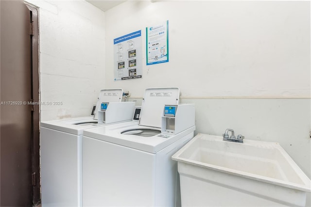 washroom featuring separate washer and dryer and sink