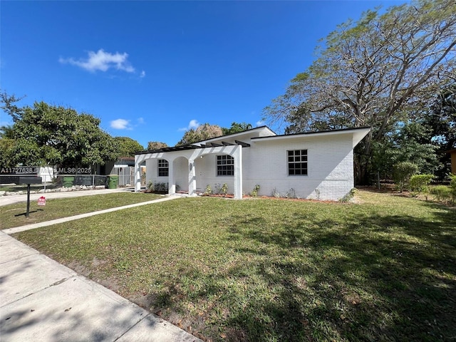 view of front of property with a front lawn