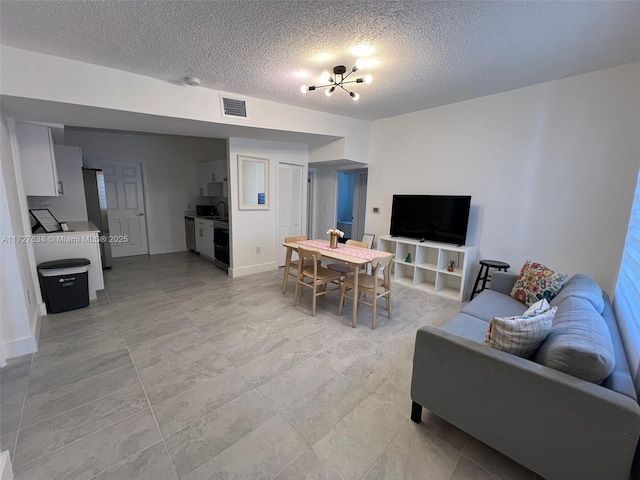 living room featuring a textured ceiling