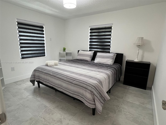 bedroom featuring a textured ceiling