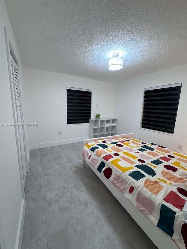 bedroom featuring a textured ceiling