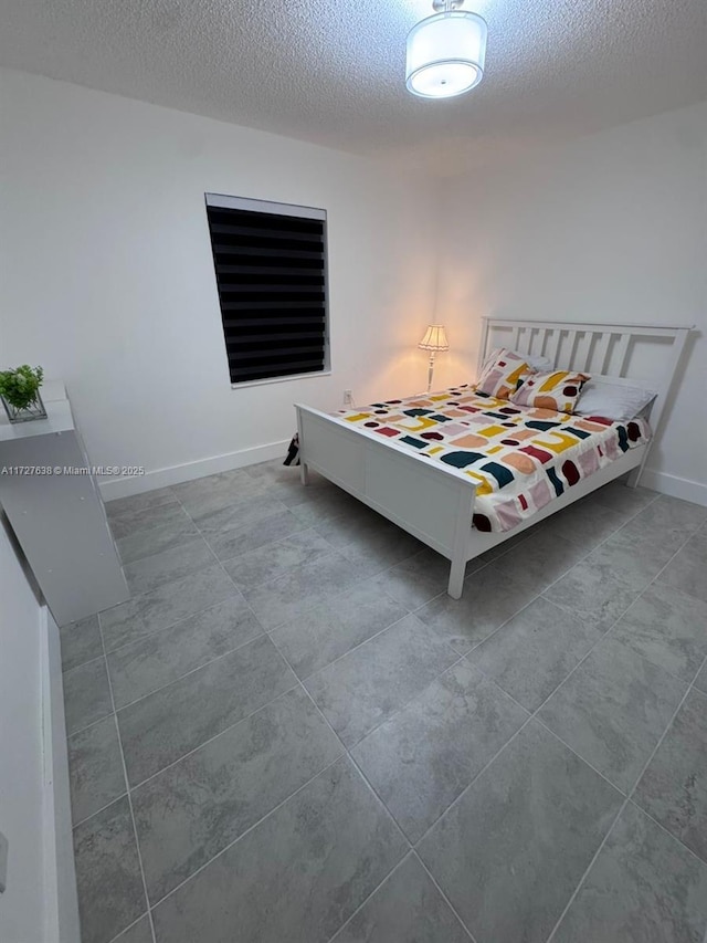 bedroom featuring a textured ceiling