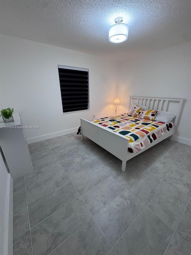 bedroom featuring a textured ceiling