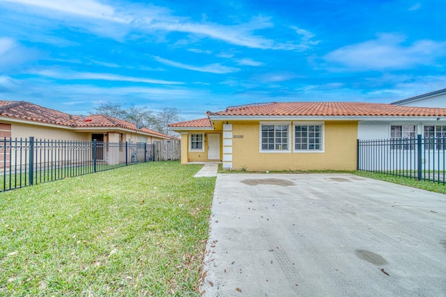 back of property with a yard and a patio