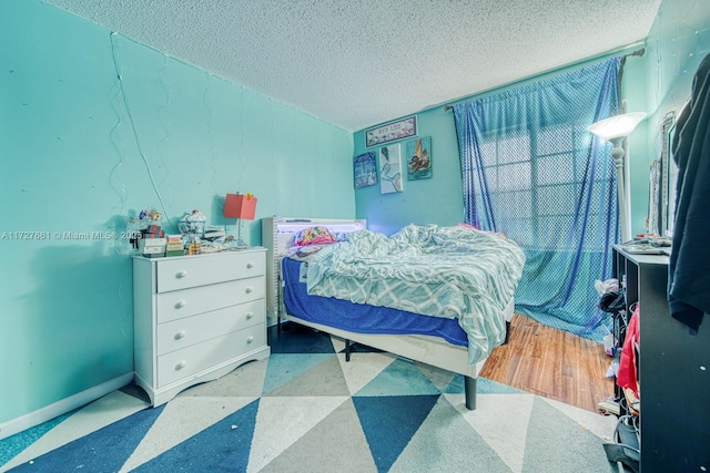 bedroom featuring a textured ceiling