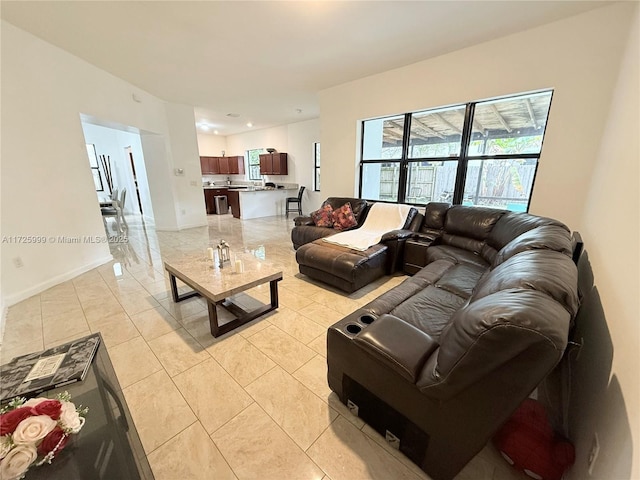 tiled living room with a wealth of natural light