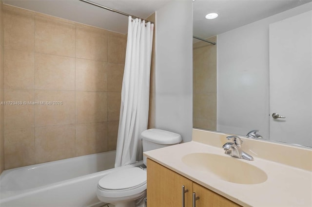 full bathroom with shower / bath combination with curtain, vanity, and toilet