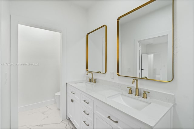 bathroom featuring toilet and vanity