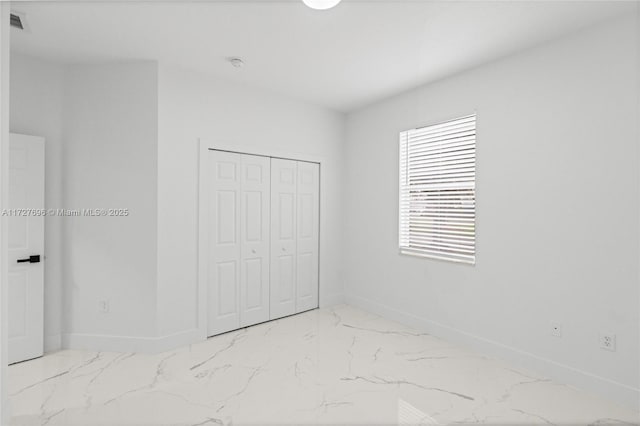 unfurnished bedroom with a closet