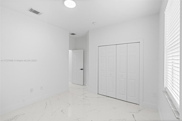 unfurnished bedroom featuring a closet