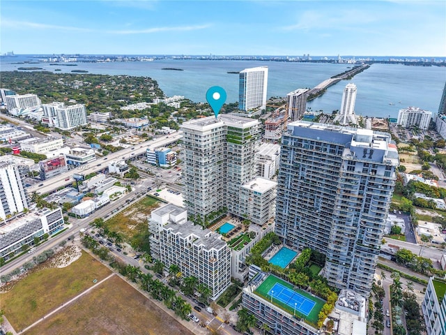 birds eye view of property with a water view