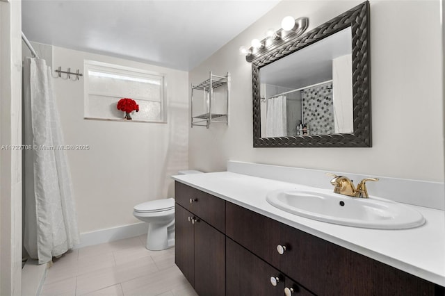 bathroom with toilet, vanity, tile patterned floors, and walk in shower