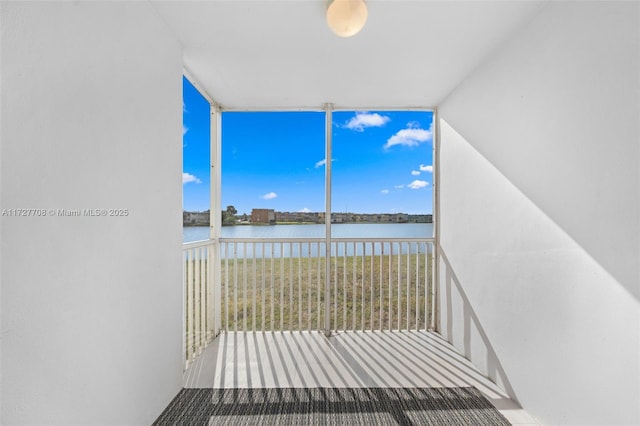 balcony featuring a water view