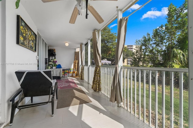 exterior space featuring ceiling fan