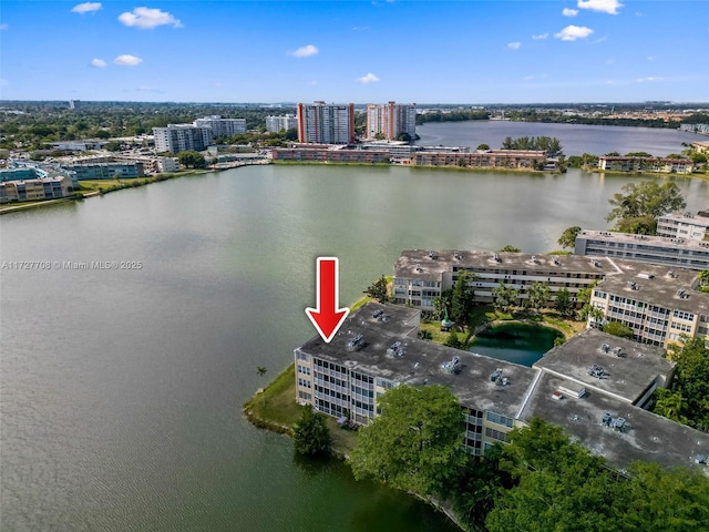 birds eye view of property with a water view