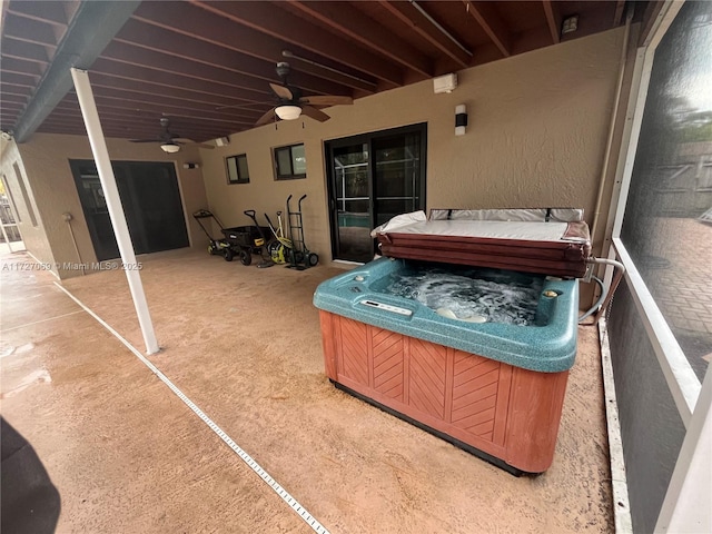 view of patio featuring a hot tub and ceiling fan