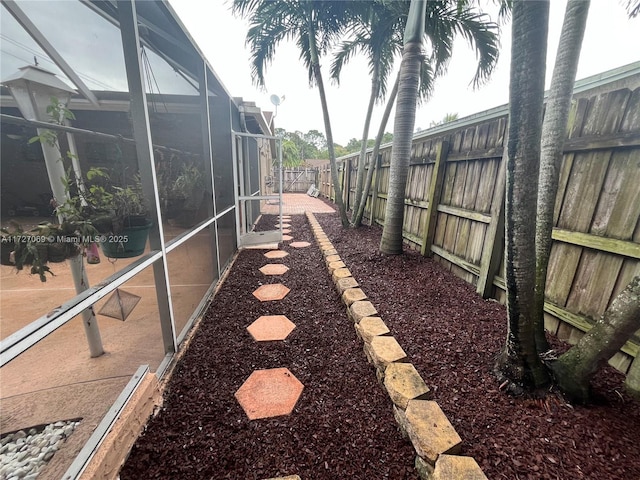 view of yard featuring a lanai