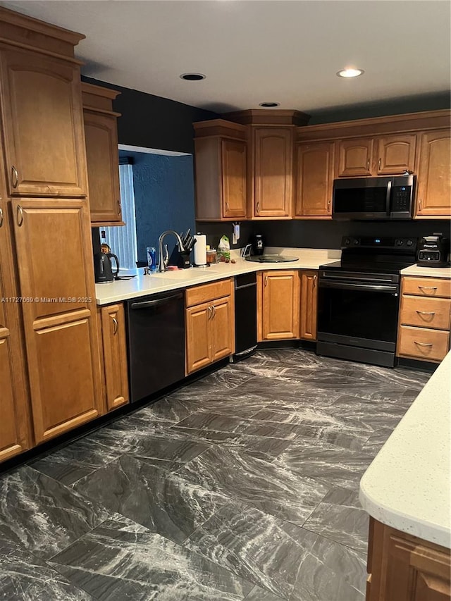 kitchen featuring sink and black appliances