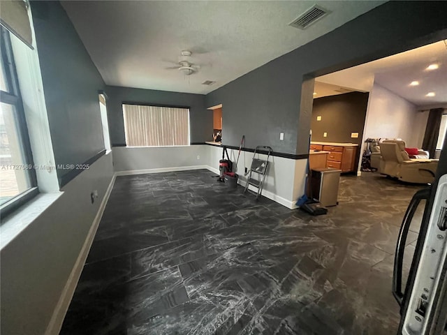 spare room featuring ceiling fan