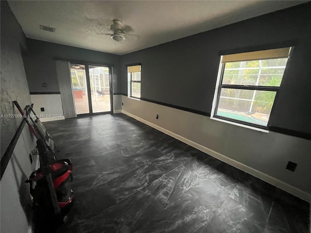 unfurnished room featuring ceiling fan