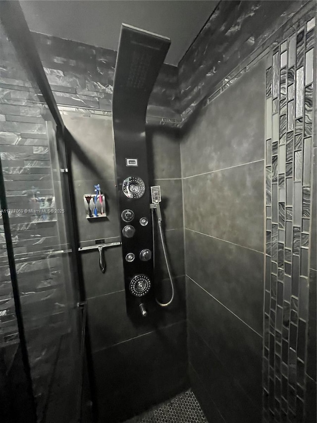 details featuring a tile shower and elevator