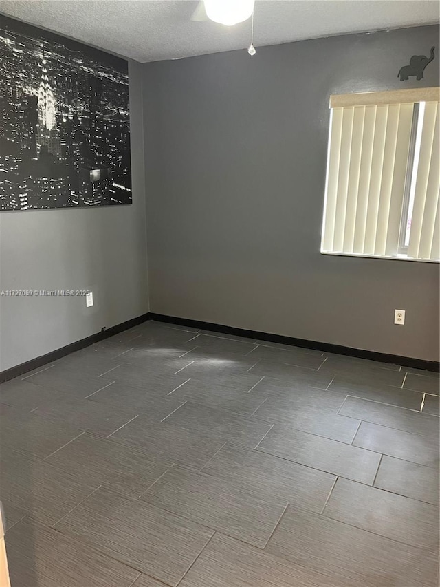 empty room with a textured ceiling