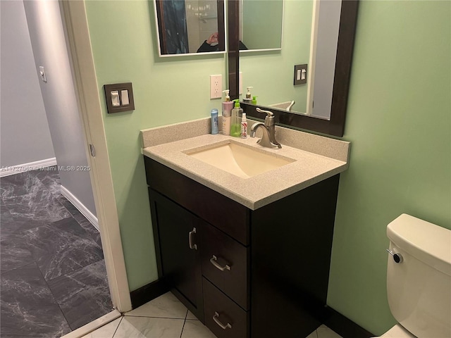 bathroom featuring vanity and toilet