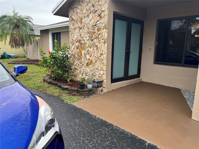 property entrance with french doors and a patio area