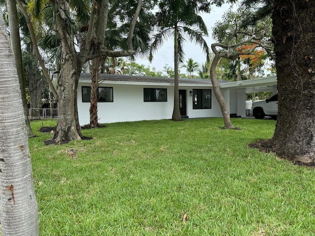 single story home featuring a front yard