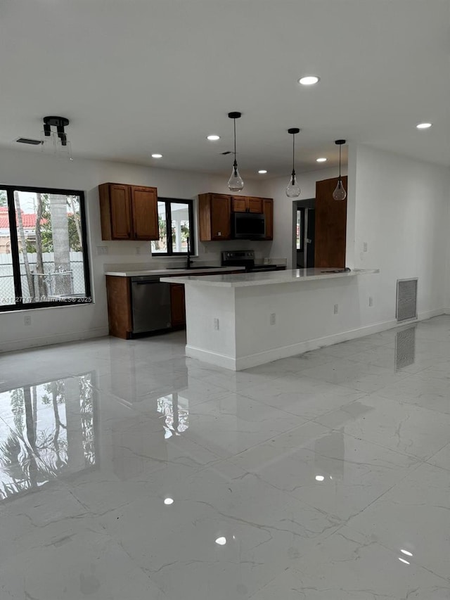 kitchen featuring sink, pendant lighting, stainless steel dishwasher, and electric stove