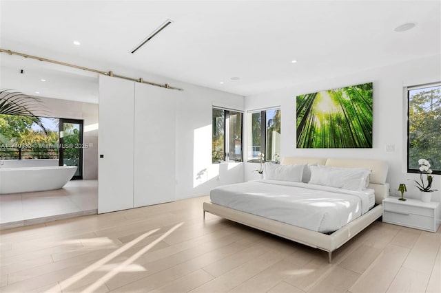 bedroom with light hardwood / wood-style flooring