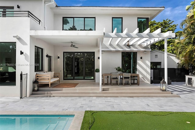 back of house with a pergola, ceiling fan, a balcony, and a patio