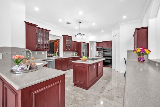 kitchen with a center island, black appliances, decorative light fixtures, backsplash, and crown molding