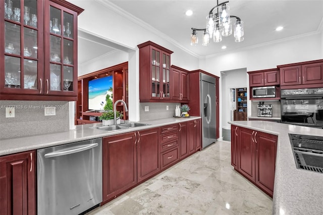 kitchen with tasteful backsplash, pendant lighting, sink, built in appliances, and ornamental molding