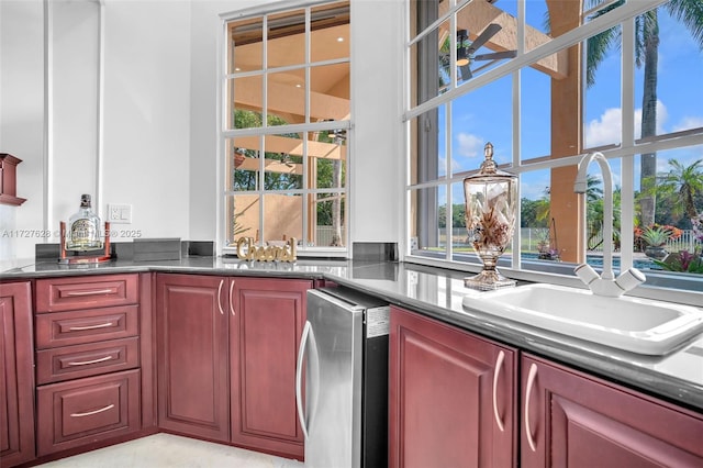 kitchen featuring wine cooler and sink