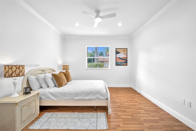 bedroom with ceiling fan, ornamental molding, and light hardwood / wood-style flooring