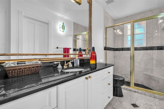 bathroom with walk in shower, vanity, and toilet