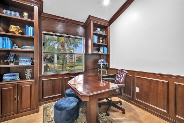 home office featuring wood walls and ornamental molding