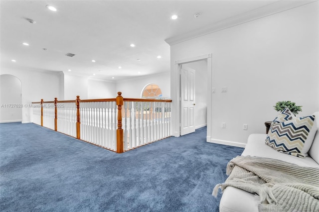 interior space with dark carpet and crown molding