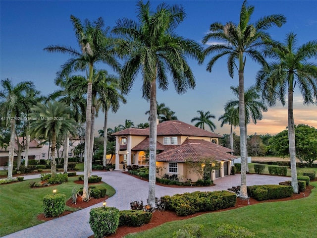 view of front of home with a lawn