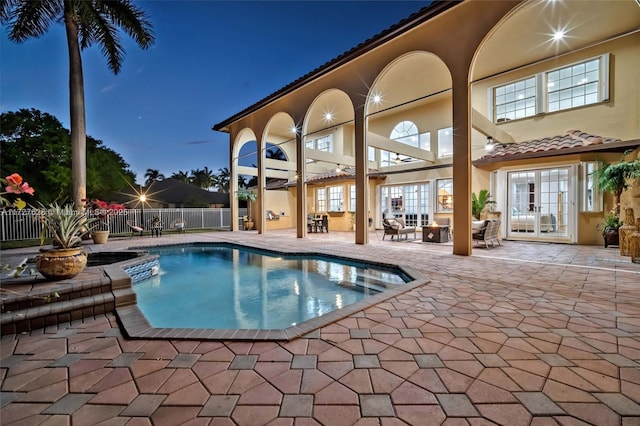 view of pool with a patio area and french doors