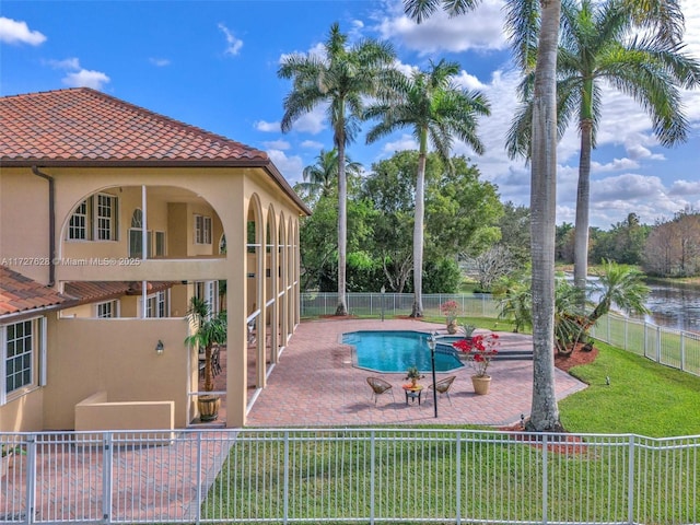 view of swimming pool featuring a patio area and a yard