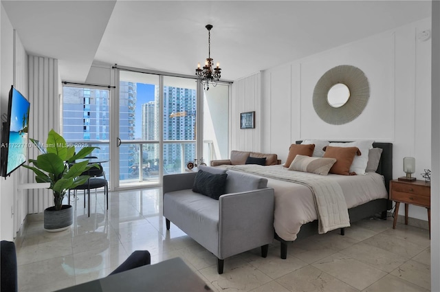 bedroom featuring a chandelier, access to exterior, expansive windows, and multiple windows