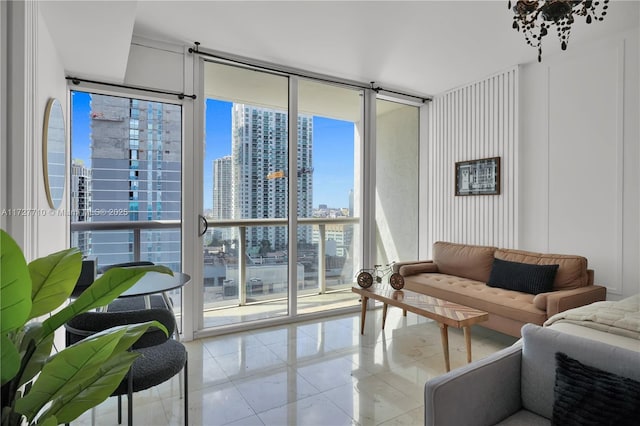 tiled living room with floor to ceiling windows