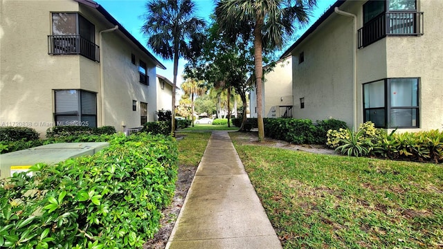 view of property's community with a yard