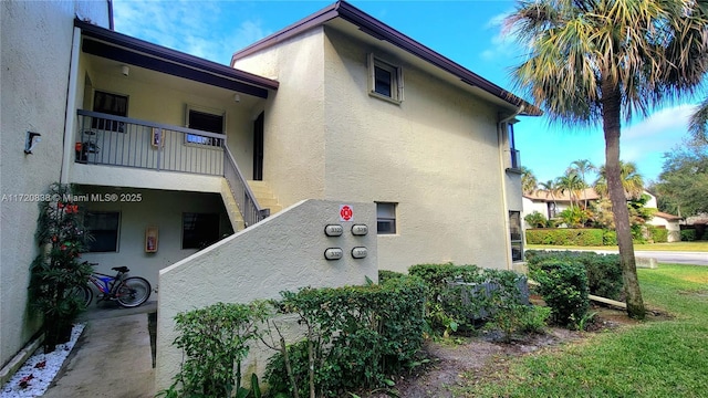 view of property exterior featuring a balcony