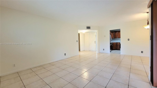 view of tiled spare room