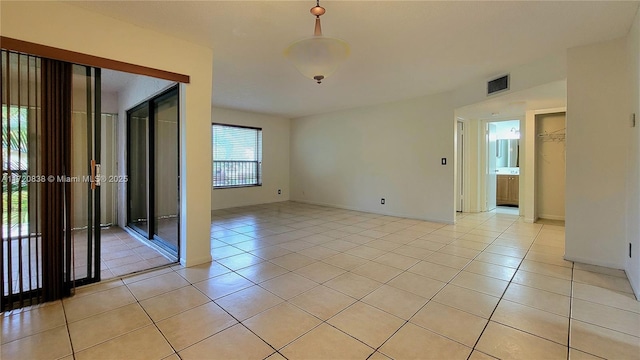 empty room featuring light tile patterned floors