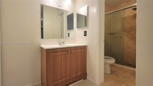 bathroom with toilet, vanity, tile patterned floors, and a shower with door