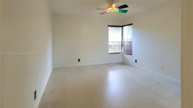 spare room with ceiling fan